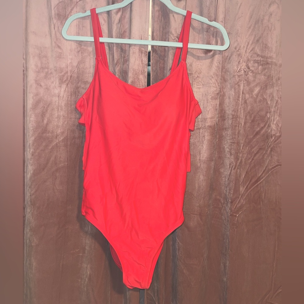 Red one piece with side cutouts